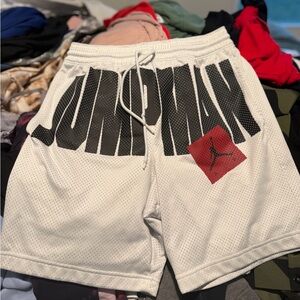 Jordan White Mesh Athletic Shorts with Black Logo and Red Jumpman Patch